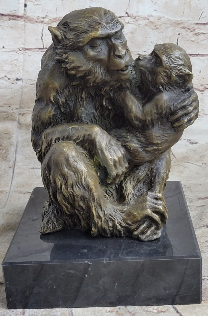 Gorilla with Baby Bronze Statue: The baboon mother and child lay hugging each other into a ball among the open savannah of an African night. Superb detail is seen in the fur of both kin; the process of casting having allowed the skil