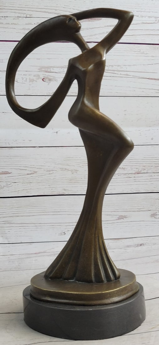 Dancer Bronze Sculpture: The suggestive female form pulls out of the base from the hem of a fanned skirt that evolves into the definition of her bent leg. Her arms both rest on her head, one in the shape of an angle while the