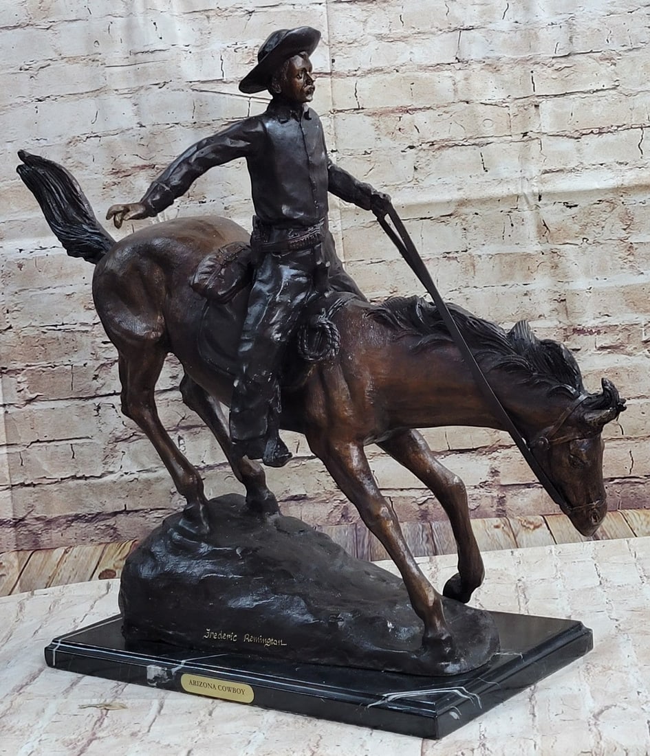 The Arizona Cowboy Bronze Sculpture: A seasoned cowboy is casually patrolling the area when suddenly something catches his attention. He yanks on the reins, pulling the horse back around. He is dressed in a shirt, chaps, and boots,