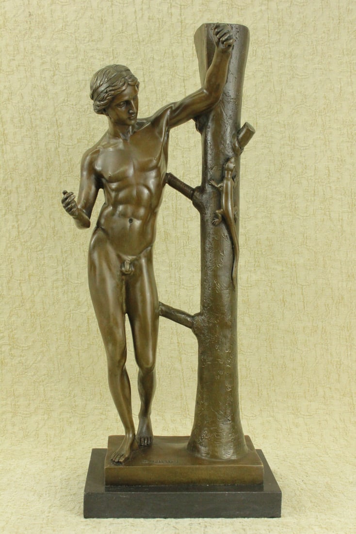 Nude Man Bronze Figurine: The nude male walks freely in a wooded garden when he comes across a lizard climbing up a tree. His curiosity takes over him as he stops, resting his left forearm on the tree, to watch the lizard