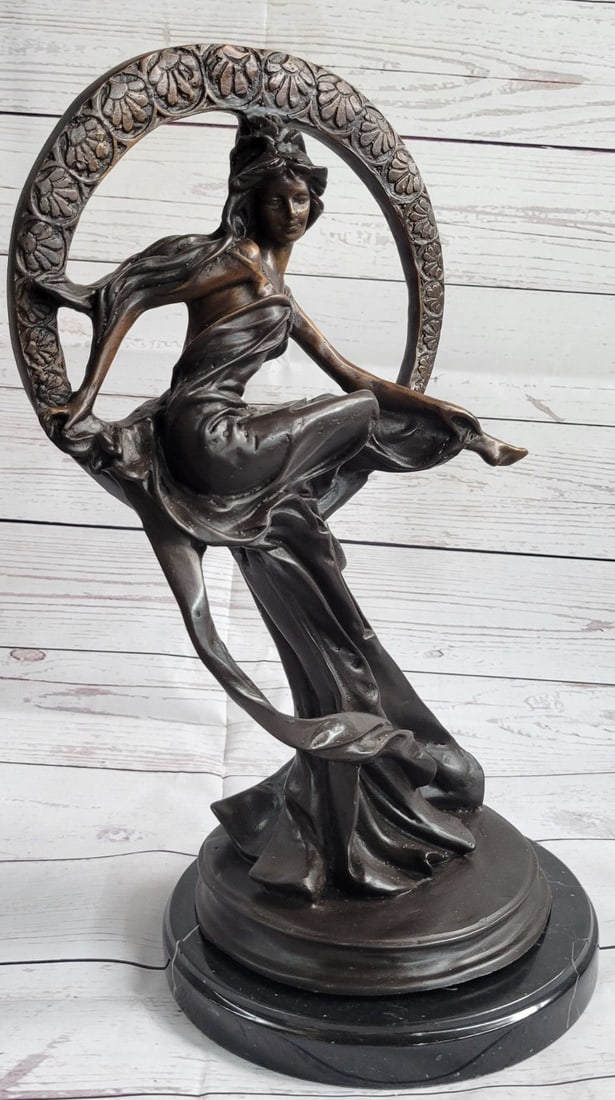 Dream Goddess With Bliss Ring Bronze Sculpture: The attention to the intricate details of these luxurious works of art is amazing and the brilliance of the figures unsurpassed. This dream goddess sits in a ring of bliss that is filled with loving