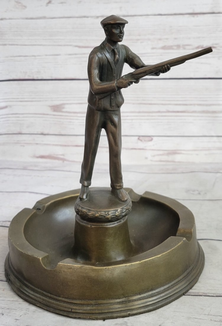 Hunter with Gun Ashtray Bronze Sculpture: This inspiring Bronze Sunrise Man Hunting Sculpture. Hunting Collection perfectly captures a classic image sure to inspire the memories and imagination of every outdoor enthusiast. A solitary hunter