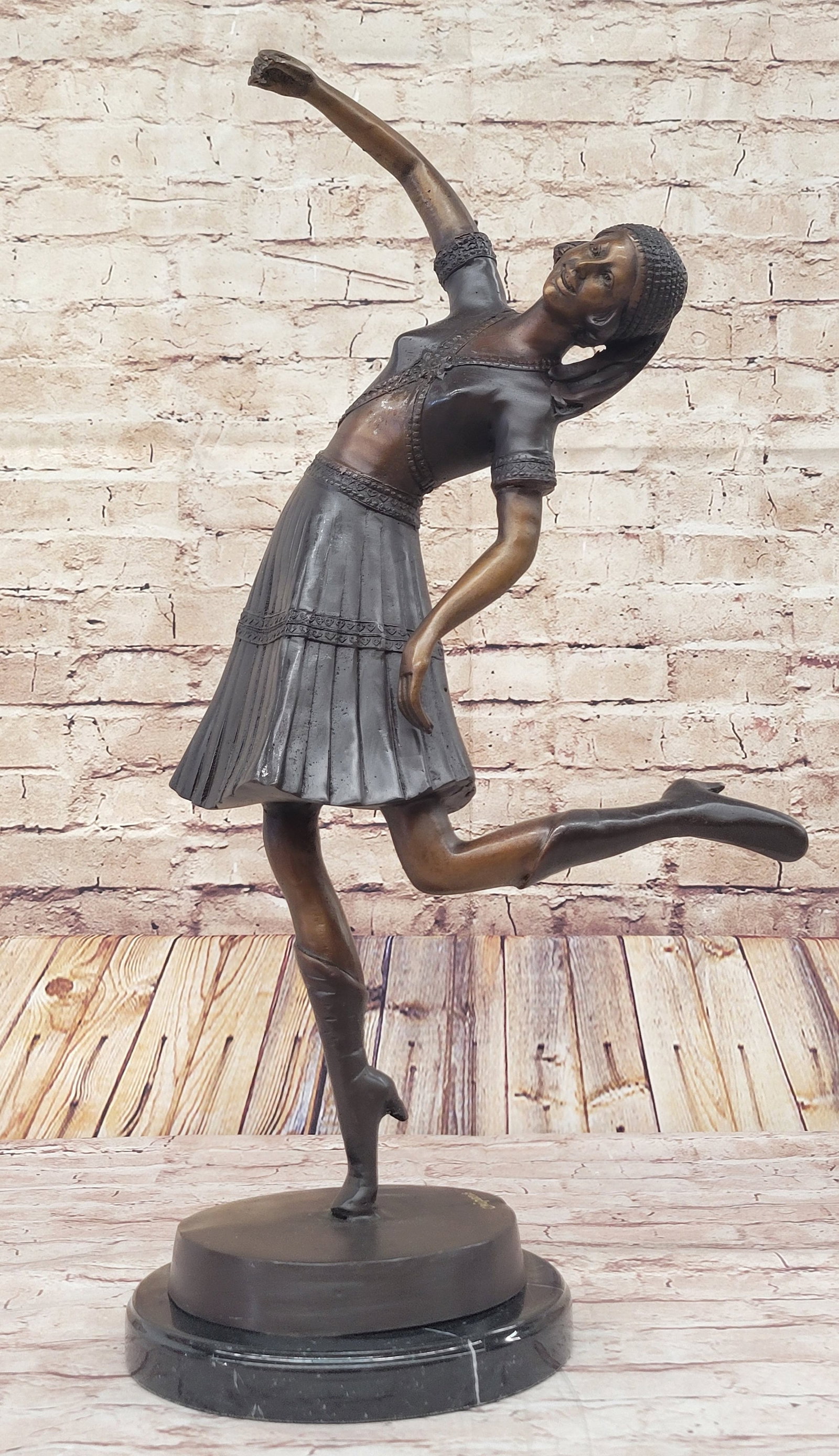Egyptian Lady Dancer Bronze Statue: This graceful Bronze dancer is exquisitely handmade complete with Egyptian symbols reflecting the period fascination with the excavation of Tutankhamen tomb. The base forms a natural pairing to the