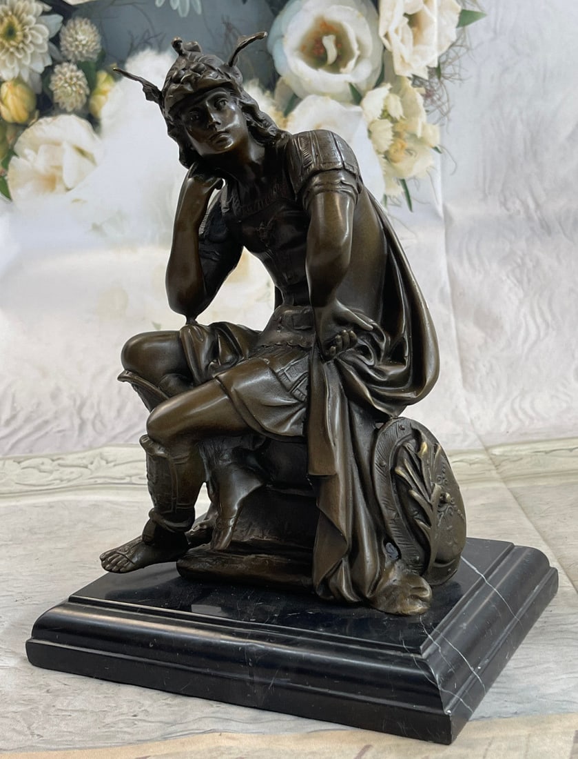 Roman Gods Mars Bronze Sculpture: Sitting, contemplating, the Roman Emperor in full armor is waiting for the right time to strike. He wears his helmet which has a serpent on the top and the mouth of a lion trimming the helmet. His