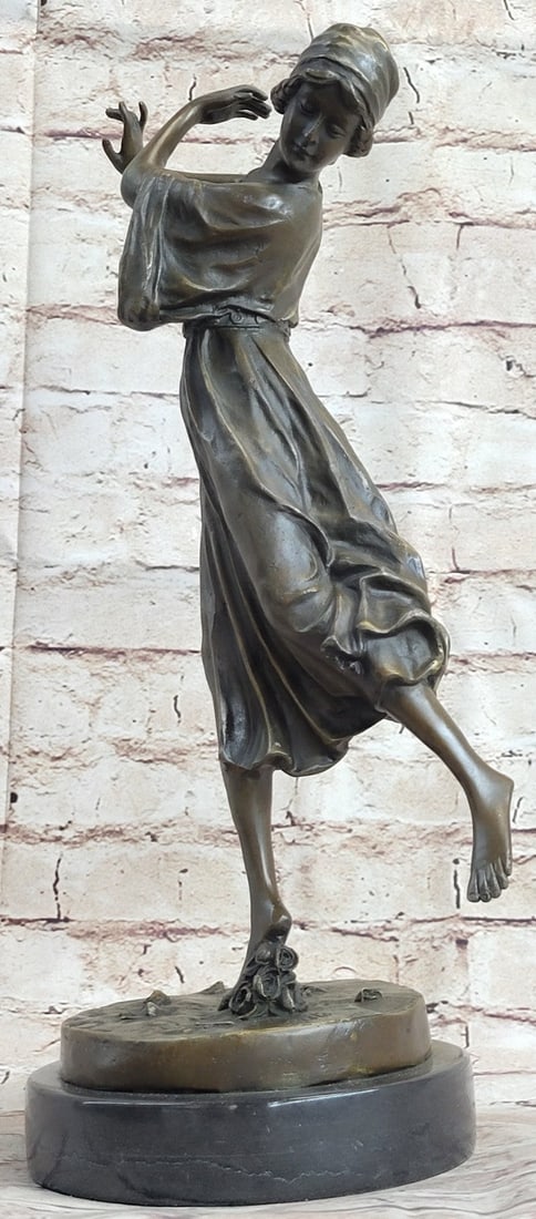 Dancer Bronze Statue: As she dances graciously across the stage, her onlookers throw roses to her for her wonderful display. She is lost in a world of dance as she lifts her leg up and steps almost steps on a bouquet of