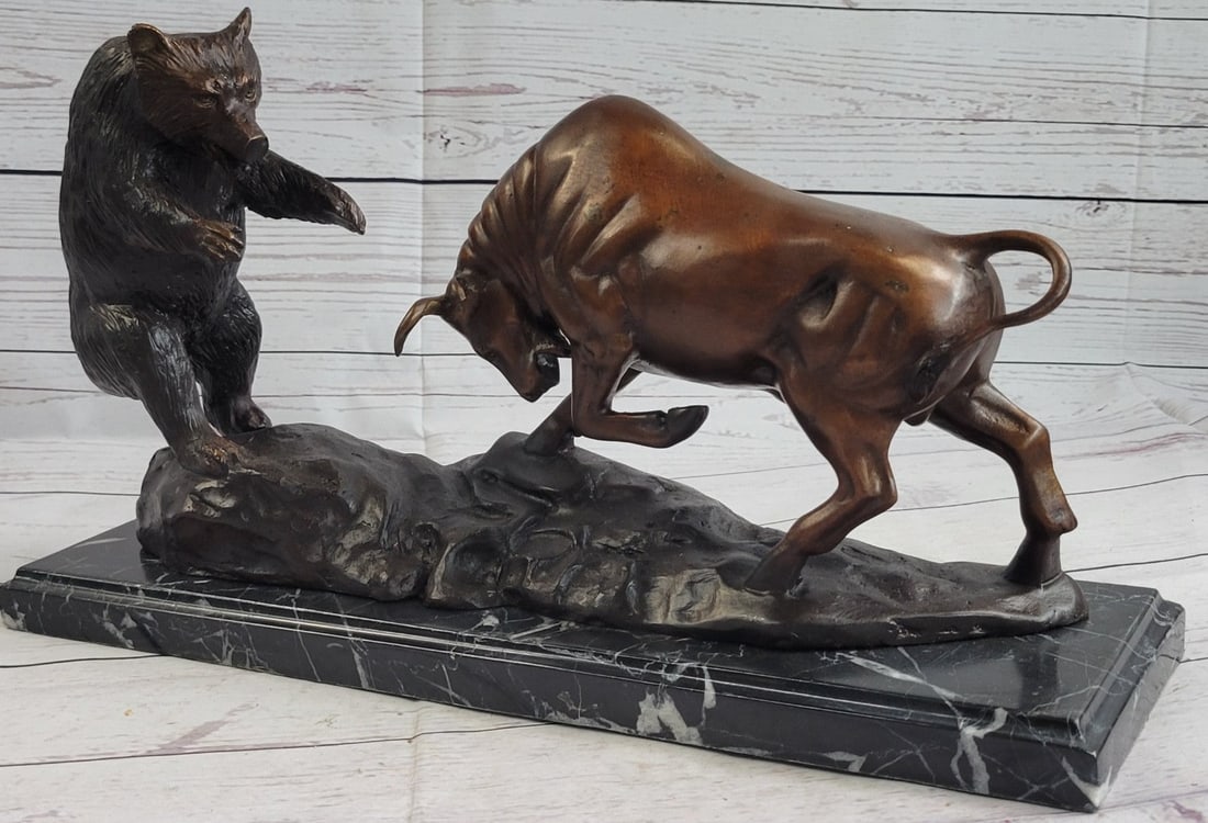 Bear and Bull Bronze Sculpture: A fierce battle has broken out between two known killers. Bull vs. Grizzly bear. The bull charges its horns in and the bear locks his massive paws over its head, pulling him into his plump body. The