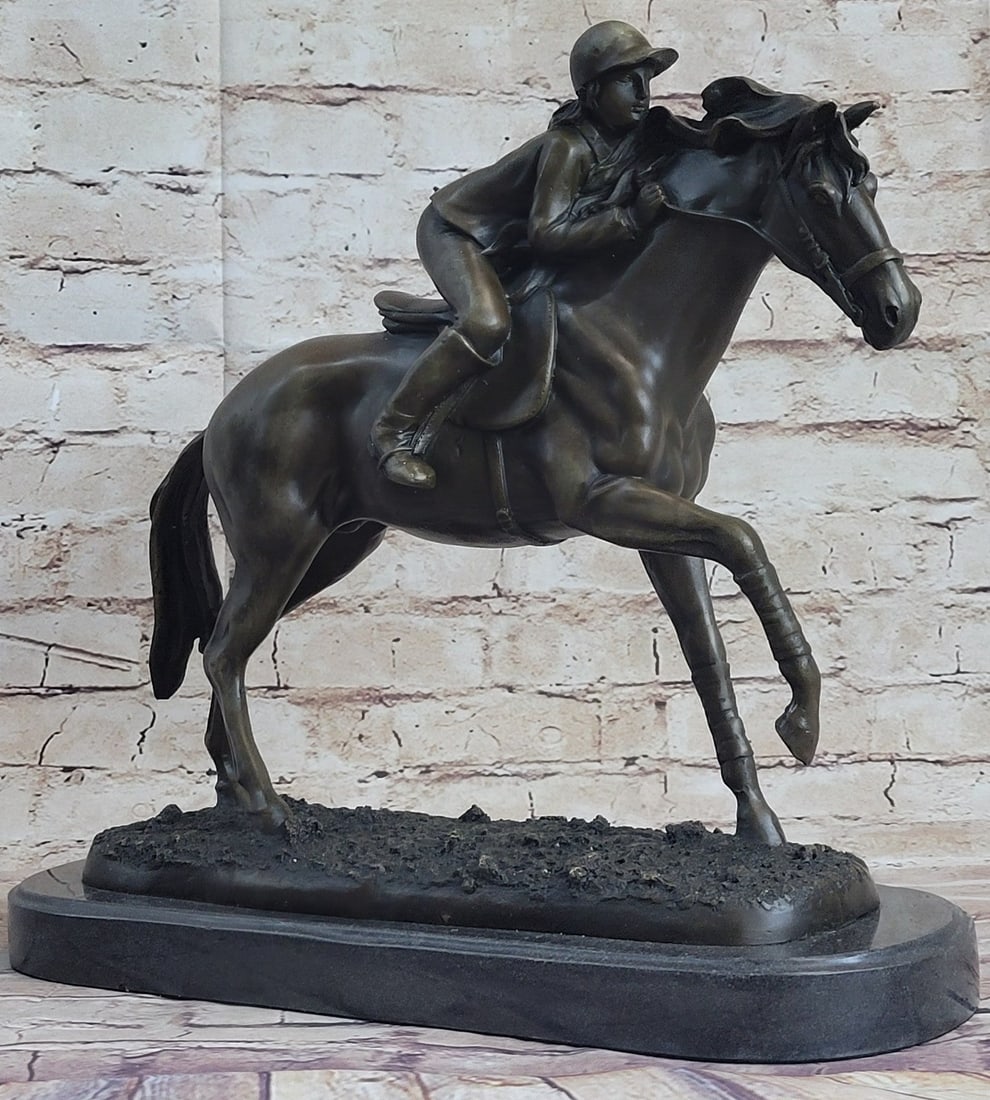 Jockey and Race Horse Bronze Sculpture: This thoroughbred and jockey are on a mission to win first place. In full stride, this horse gallops his way to a fast finish. Running on a grass track this horse refuses to lose this derby. He exerts