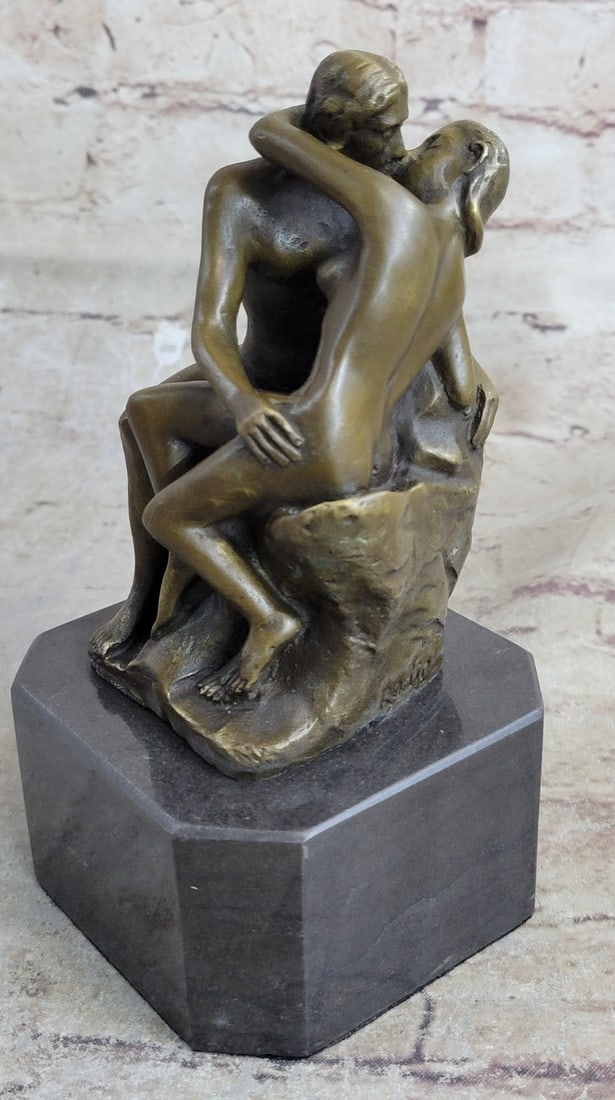 Kiss Bronze Sculpture: This bronze sculpture was molded using the age-old methods of lost-wax casting and stained with a brown patina finish and mounted upon a marble base. Dimensions: Height?6 X Width?4 inches. Weight: 4 L