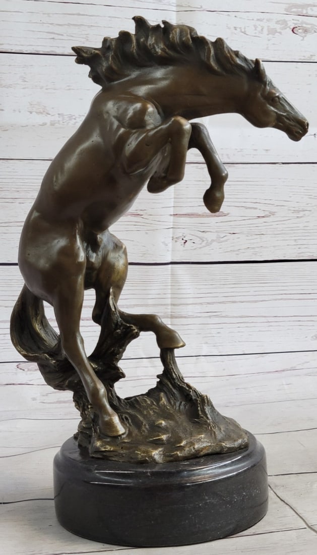 Western Art Cowboy Horse Bronze Statue: This piece, which has been crafted with exquisite detail, features a rambunctious horse in a standing pose. Due to its natural companionship with man in both work and art, the horse has always held a