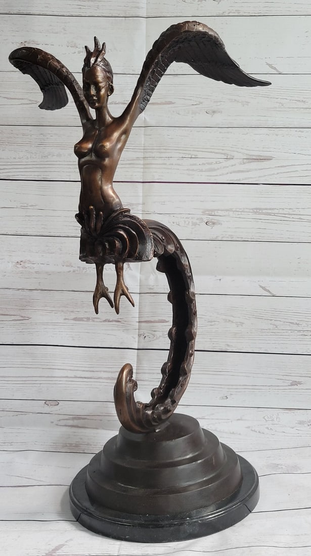 Lady Meiji Japanese Bronze Sculpture: This sculpture is mounted on a marble base and tapering up rests her long and elegant tail. Her naked upper torso is lean and curvaceous. Her face is exquisitely detailed and refined, her eyes sleek a
