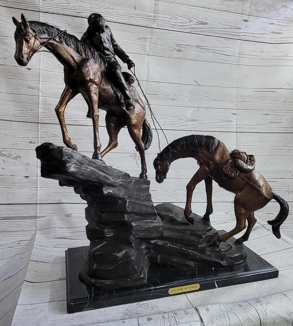 Large Remington Tribute 2 Horses and Cowboy Bronze Sculpture Marble Statue Decor: The Two Horses Cowboy Statue is a great piece of artwork! An affordable piece for home decor looks just great on any table or shelf. This sculpture is a two-toned brown patina sculpture that was cast 