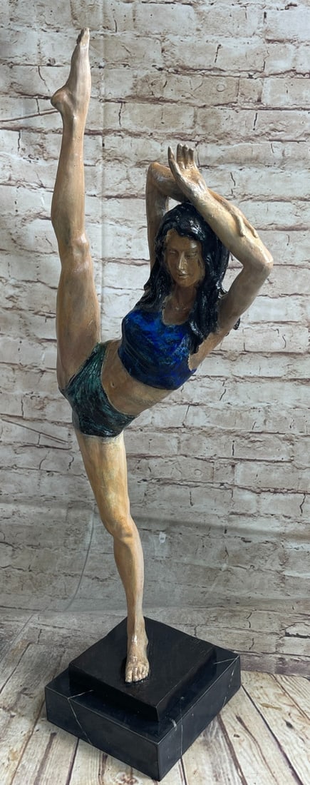 Gymnast Woman Bronze Statue: This woman is a talented Gymnast demonstrating her agility and flexibility. Balancing on one foot as she has her other feet stretched in the air. Her muscular legs curve backward and rest in her