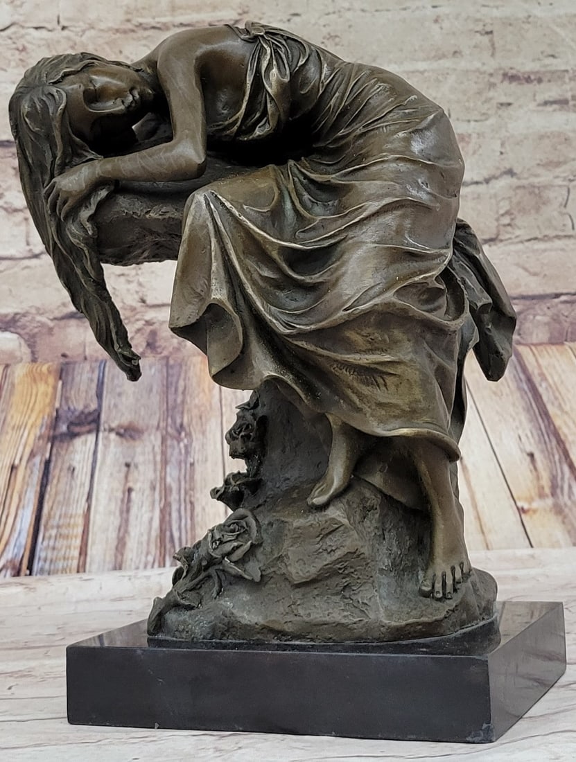 Naked Lady Resting Bronze Sculpture: Her nude bodice drapes over the rock conforming to it almost as if she becomes one with the rock. She shows her deep sensual soft side, and like a rock, she will hold her emotions sturdy and true. She