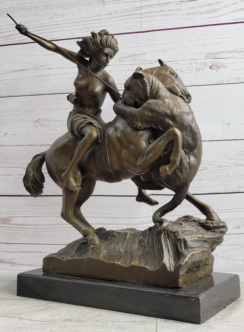 Amazon Warrior on Horse Bronze Sculpture: The Mounted Amazon Attacked by a Panther was the work of German sculptor Caught in the midst of the attack, the figures convey the violence and emotional tension of the moment. The Amazon was installe