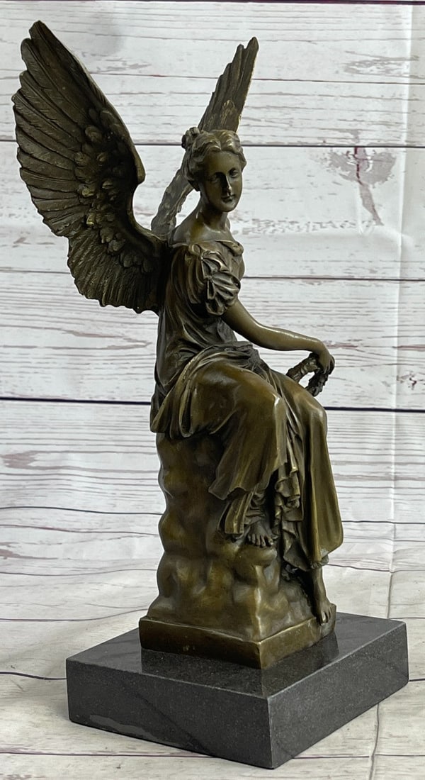 Beautiful Angel sits on Celestial Throne Bronze Sculpture: The beautiful angel sits upon her celestial throne having surveyed an earthly battle. She is captured in the likeness of ancient Roman Hellenistic representations of winged angels. The exquisite detai