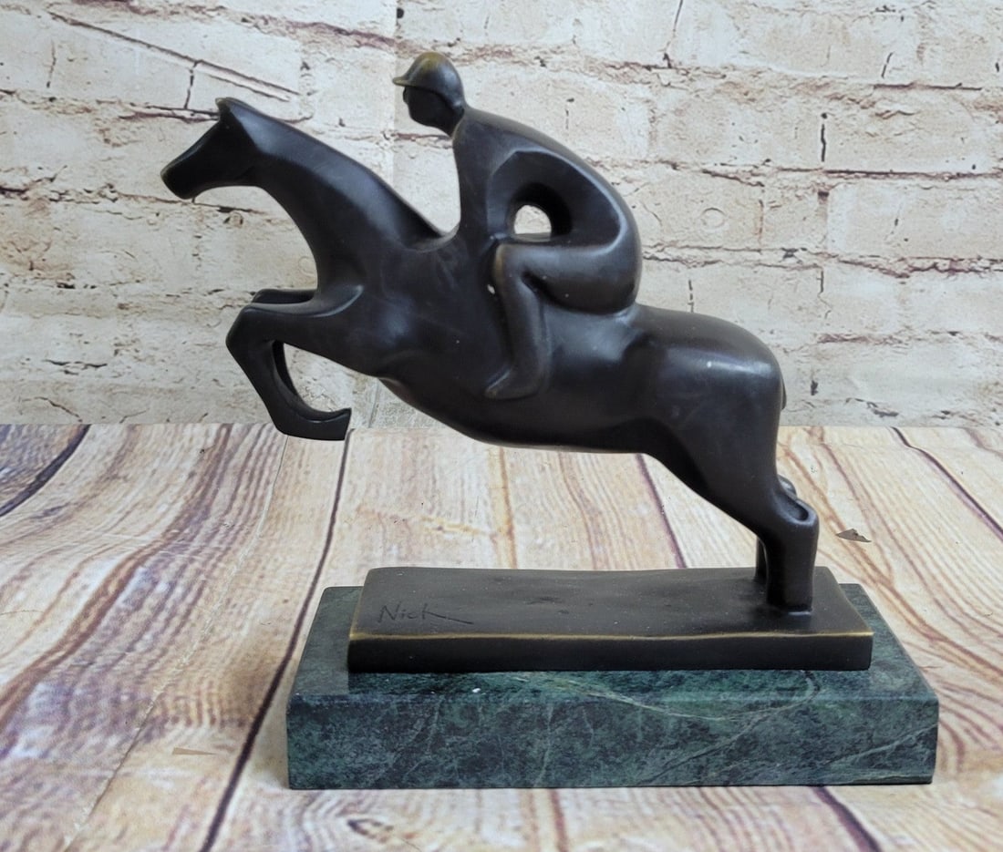 Sport Jockey on Horse Bronze Sculpture: This thoroughbred and jockey are on a mission to win first place. In full stride this horse gallops his way to a fast finish. Running on a grass track this horse refuses to lose this derby. He exerts 