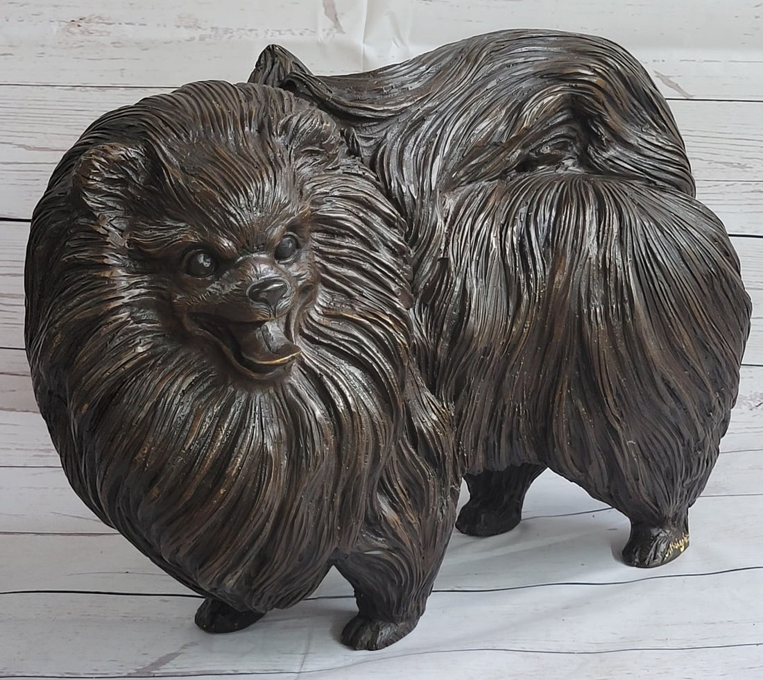 Russian Pomeranian Bronze Sculpture: This cute and cuddly little Pomeranian is just begging for you to take her home. It looks as if she has just come out of the groomers with a fresh cute and perky step. It is almost like the real thing