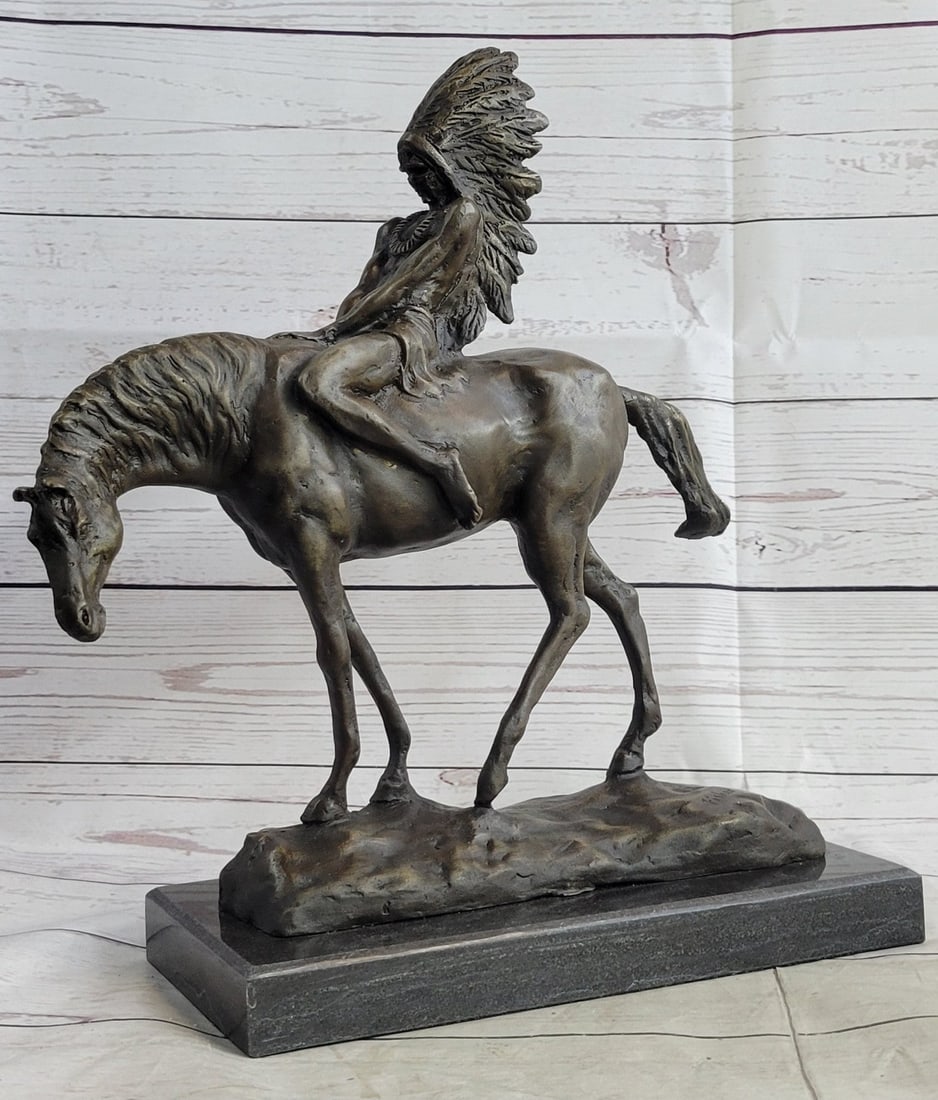 Chief Rides Horse Bronze Sculpture: A young Native American chief rides on horseback through the wilderness. He is headdress is filled with feathers obtained through acts of wisdom and bravery. The detail in this piece allows you to see