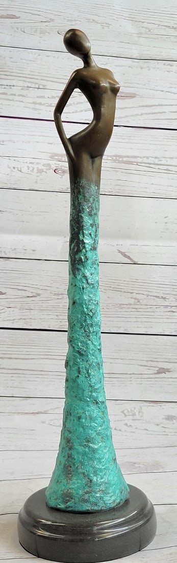 Modern Bronze Sculpture: This is a tall and stunning piece that will certainly accentuate the space in which it is placed. The beautiful ocean colors stem from the base of the sculpture and flow upwards until the sculpture