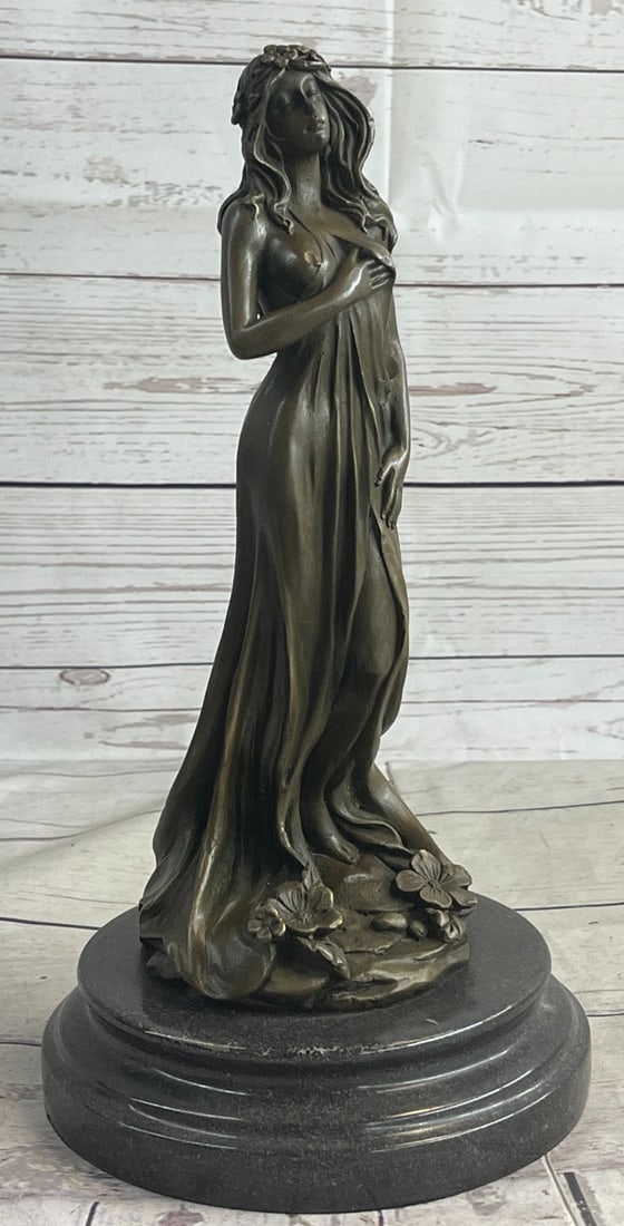 Liberated Maiden Bronze Sculpture: The beholder has come across a liberated maiden who has ventured through a field escaping to a sense of purity. She hikes up and down the forest, gracefully with both arms at her sides she steps out