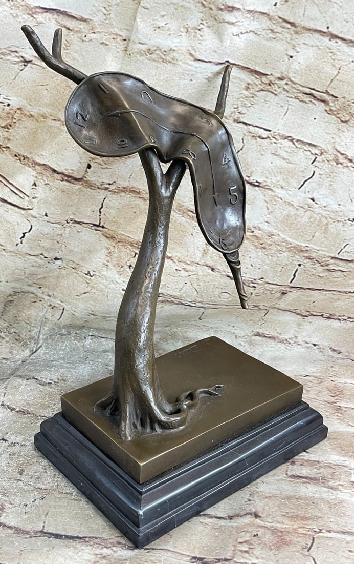 Melting Clock Bronze Sculpture: The Bronze Sculpture Was Cast Using lost wax Method And Finished With A Brown Patina Stain For Preservation. Dimensions: Height 13 X Width 10 inches. Weight: 10 LBS.