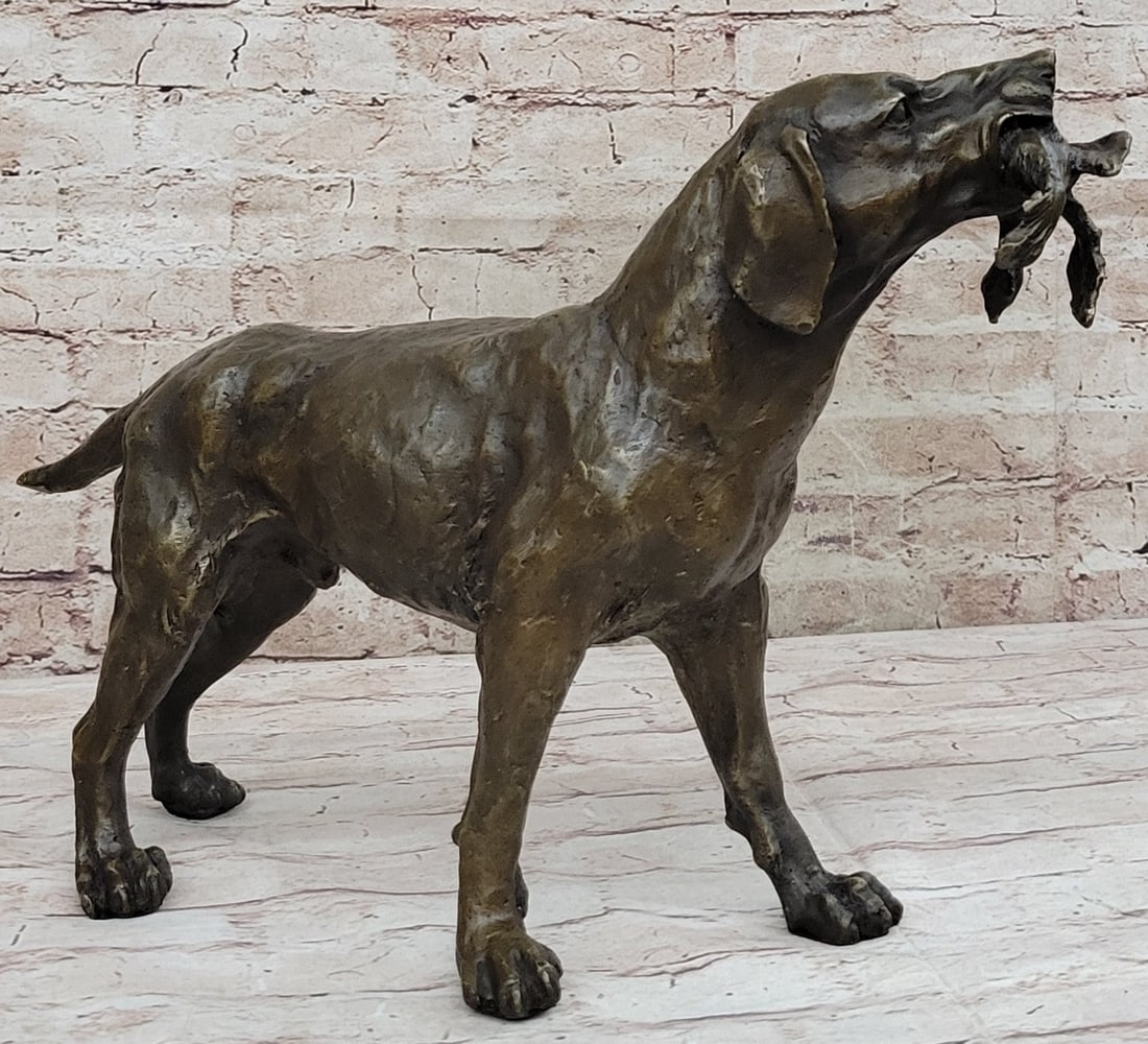 Shaggy Dog Captures a Bird Bronze Sculpture: This intense piece features a dog with a dead bird in his mouth. He is looking ahead of him, as his owner has undoubtedly given him the order to capture the creature that he just shot. The lifeless