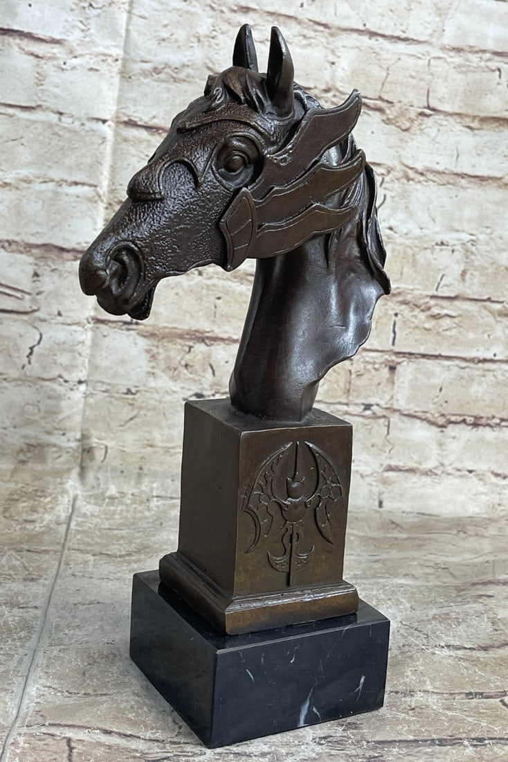 Bust Horse Bronze Sculpture: The horse seems to be excited or spooked. He bends his head down towards his body as his hair flows upwards as if he is bucking and he opens his mouth letting out a neigh. This sculpture is beautifull