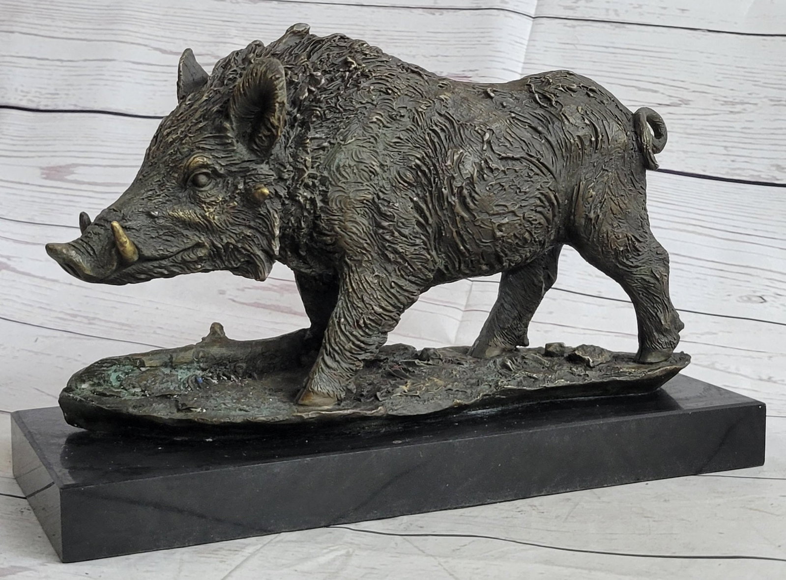 Animal Edition Bronze Sculpture: The wild boar looks out at the beholder free and defiant coming out of the forest edge to forage for food in the late afternoon. From head to tail, his attitude demonstrates bold alertness to his surr