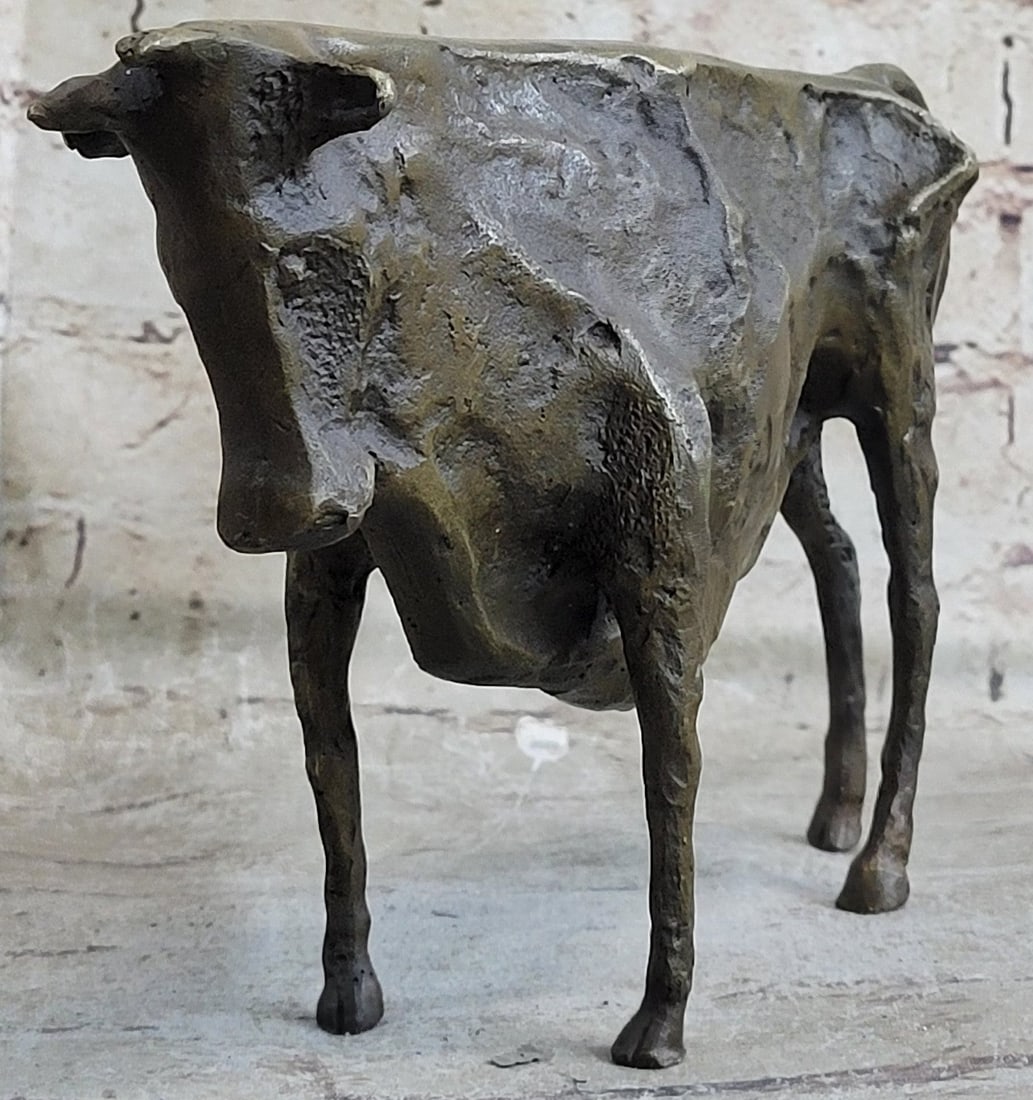 Bull Bronze Statue: This is a small animal Bronze Art slim abstract bull. This Sculpture is an absolutely great artwork with a motive full of strength and fighting spirit which the bull can always use to win against the