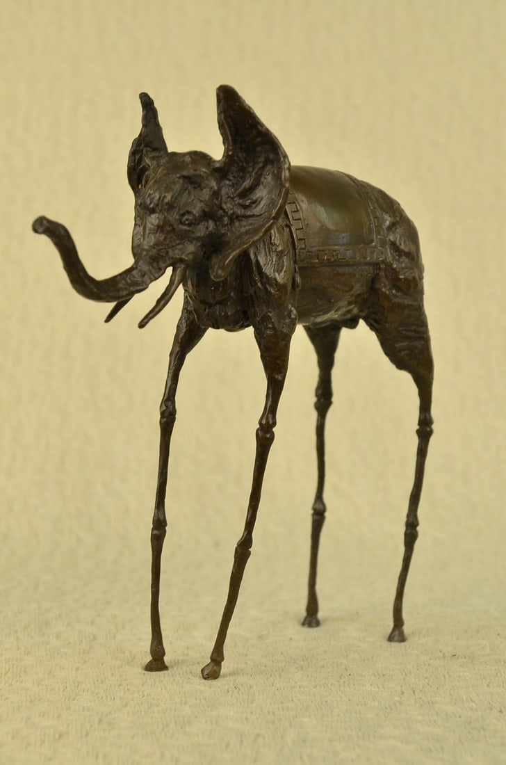 Modern Elephant with Long Legs Bronze Sculpture: This bronze sculpture was cast using the Lost Wax Method, has a beautiful brown patina. Dimensions: Height 12 X Width 12 inches. Weight: 6 LBS.