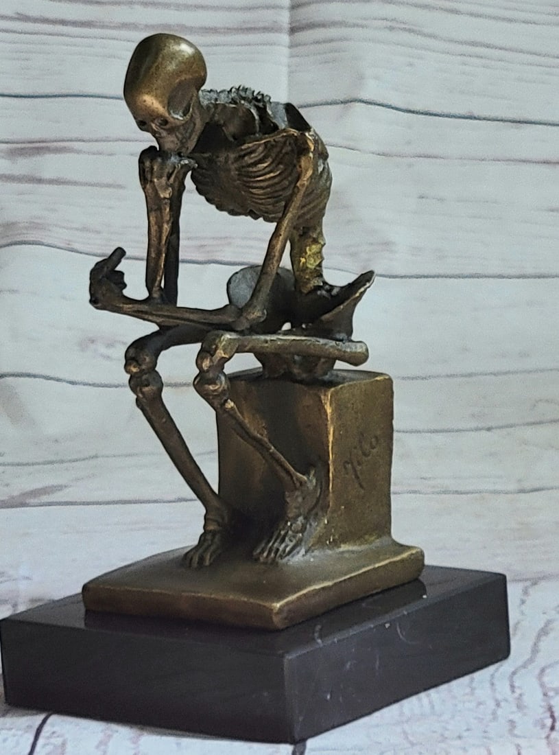 Thinker Skeleton Bronze Sculpture: Initially named The Poet, The Thinker Statue was intended to represent Dante himself at the top of the door reflecting on the scene below. The Thinker is depicted as a man in sober meditation