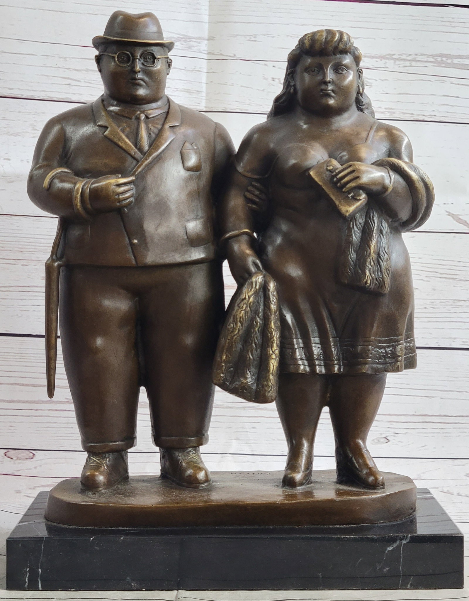 Stroll Couple Bronze Sculpture: This is an amazing piece that is beyond belief astonishing. This lovely couple takes a stroll through the park before attending their party. Largely in figure but yet very beautiful, the woman has