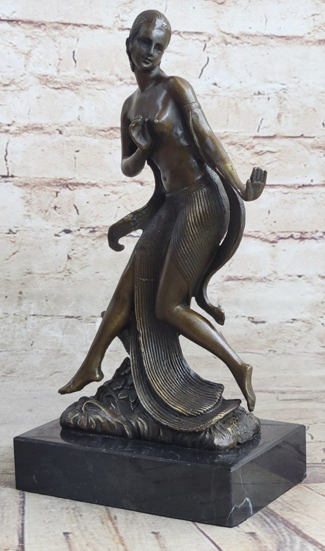 Female Dancer Bronze Sculpture: She smiles as she runs through the flower fields she is topless and her skirt flows in the wind as she runs. She wears armbands and attached to them are long flowing clothes that match her skirt. She 