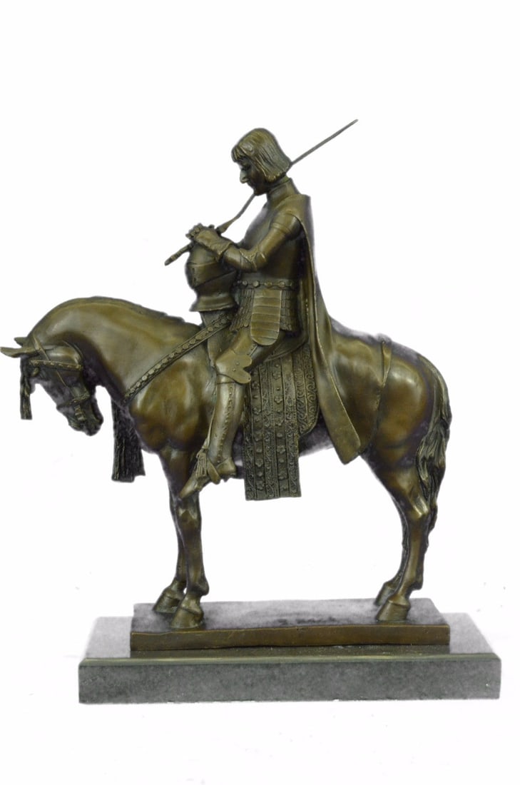 King Arthur on Horse with His Sword Bronze Sculpture: Bowing his head to draw inner strength, King Arthur of Camelot prepares for medieval battle, Gothic armor, trusty steed, and the sword Excalibur at hand. Sculpted in amazing detail from the horse brai