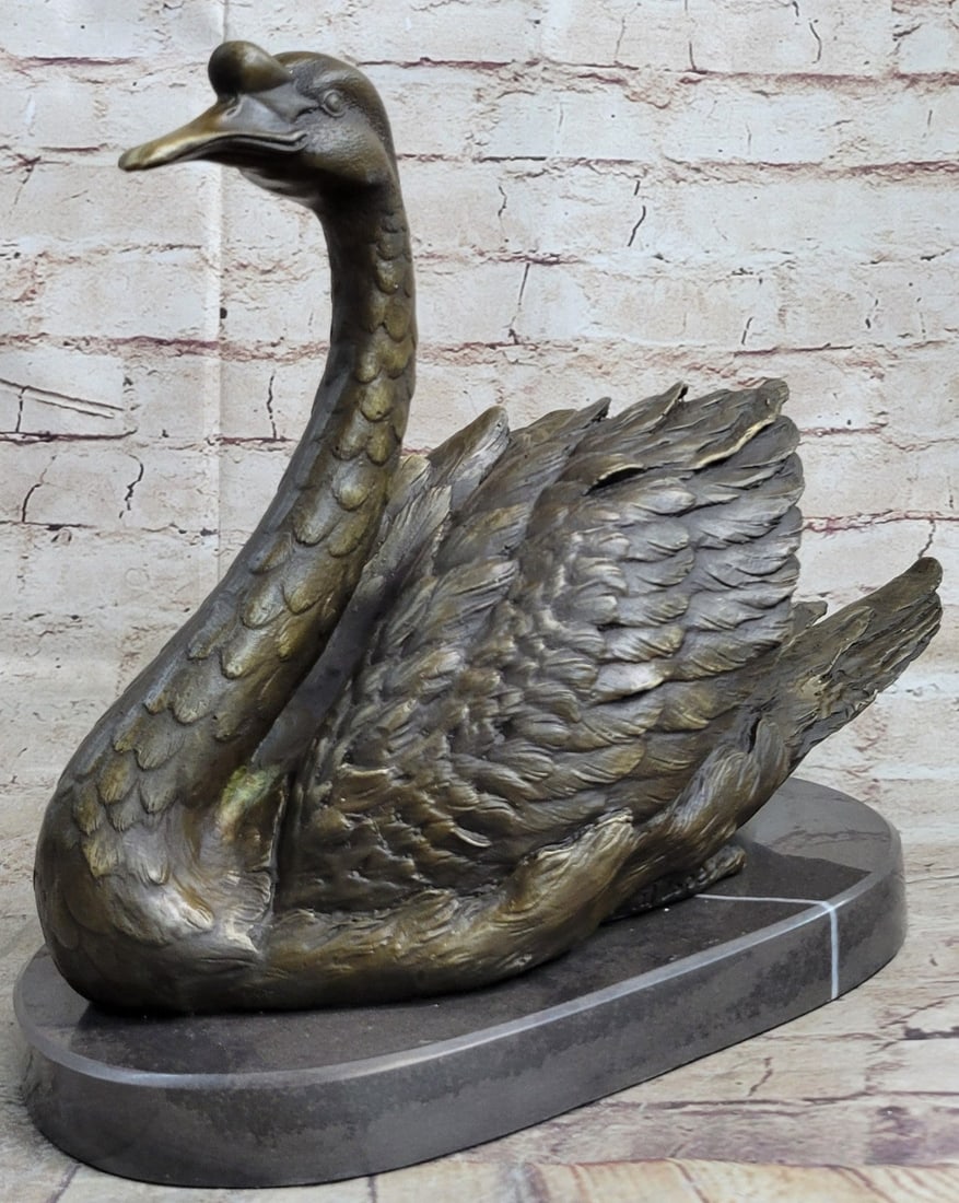 Lifelike Beautiful Swan Bronze Statue: This is an amazing Bronze Casting of a Beautiful Swan. The feathers have been intricately created with the utmost detail. This representation features a Swan with its feathers slightly fanned out,