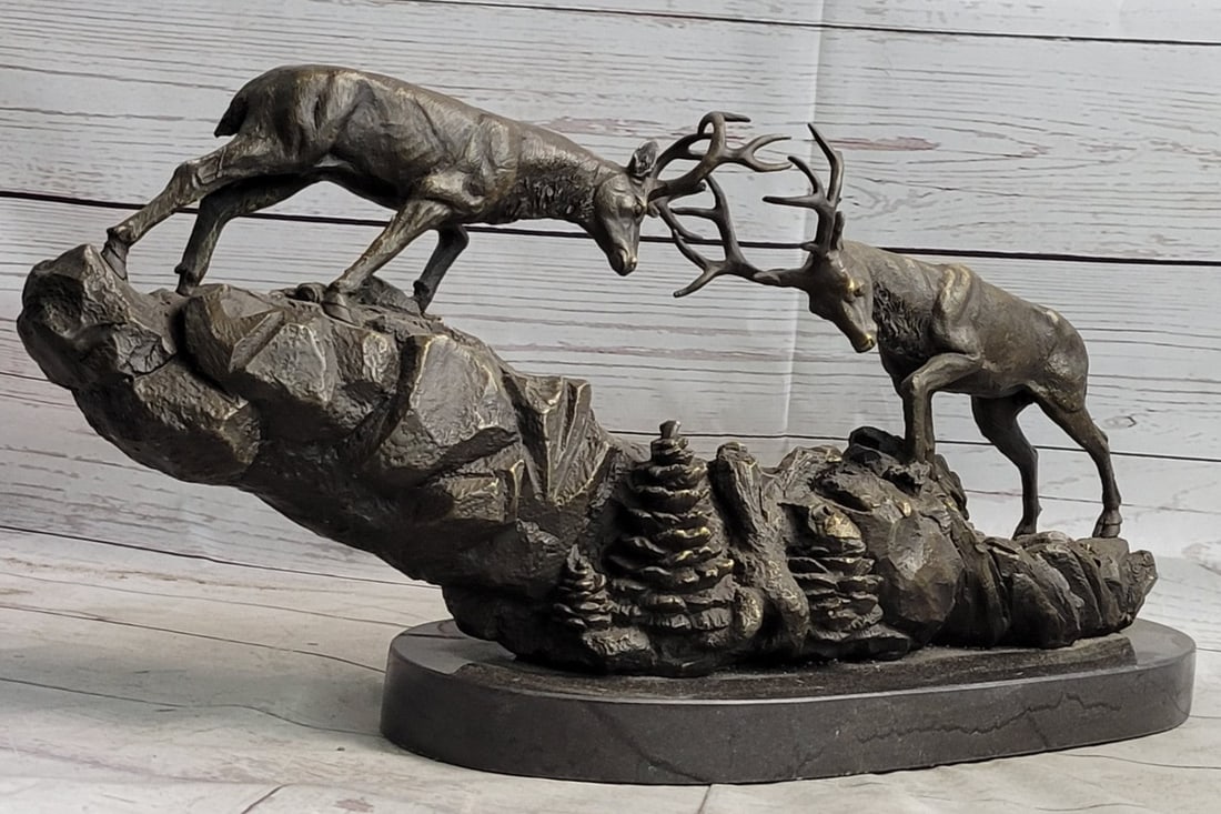 Two Large Fighting Stags Wildlife Cabin Bronze Sculpture: This bronze of fighting Red Deer stags captures the movement in the animals perfectly. The artist is phenomenal for capturing movement in his subjects. This bronze sculpture was molded using the