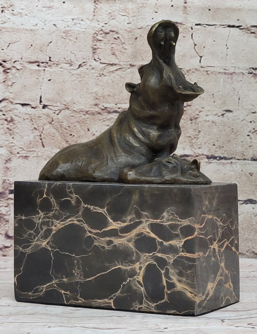 Animal Edition Hippo Bronze Sculptures: The hippopotamus is sacred in Egyptian and African traditions as a link to spirit, art and the healing realms of water. Our braying Art Deco-inspired Hippo statue rewards viewers with a vibrant