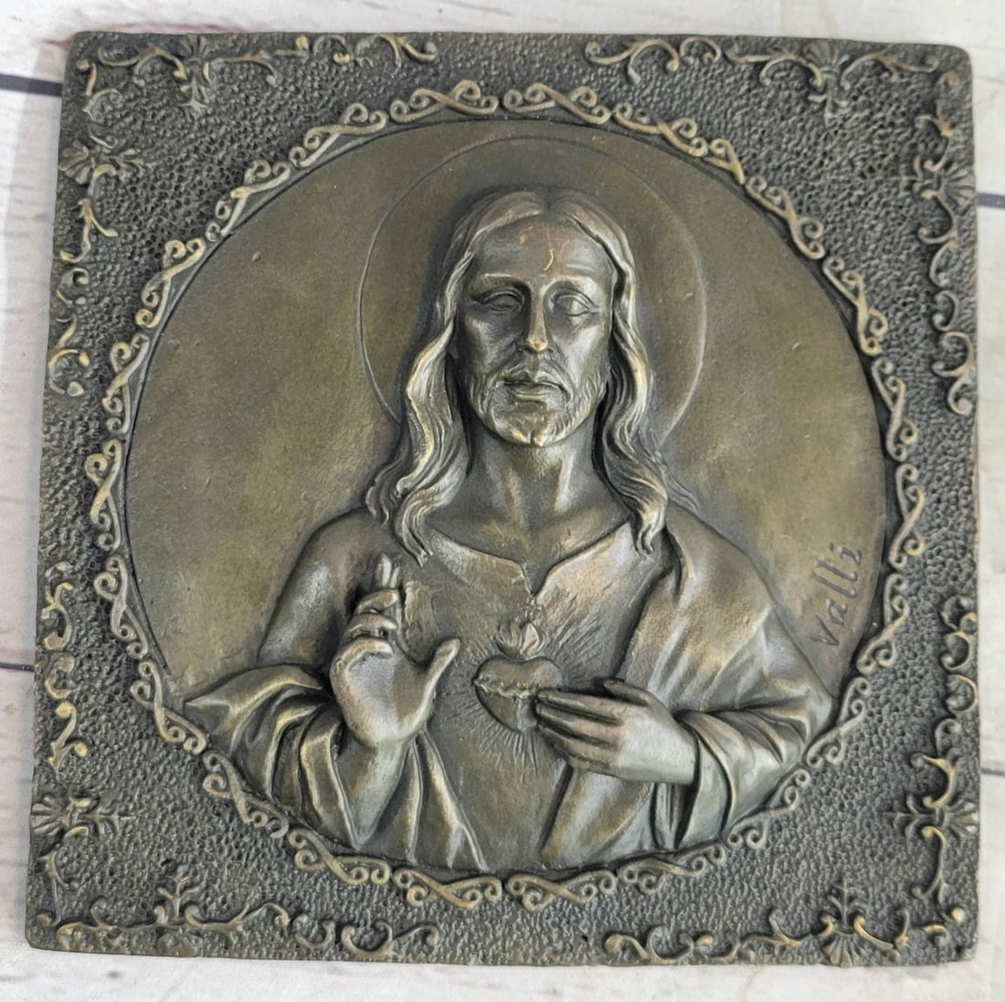 Jesus Christ and Angel Wall Mount Bronze Figurine: The portrait of Jesus is elegantly represented in this beautiful hand-crafted work. Crafted in real hot cast bronze, it is hand-tinted with subtle hues for a classic and timeless look and is a wall mo