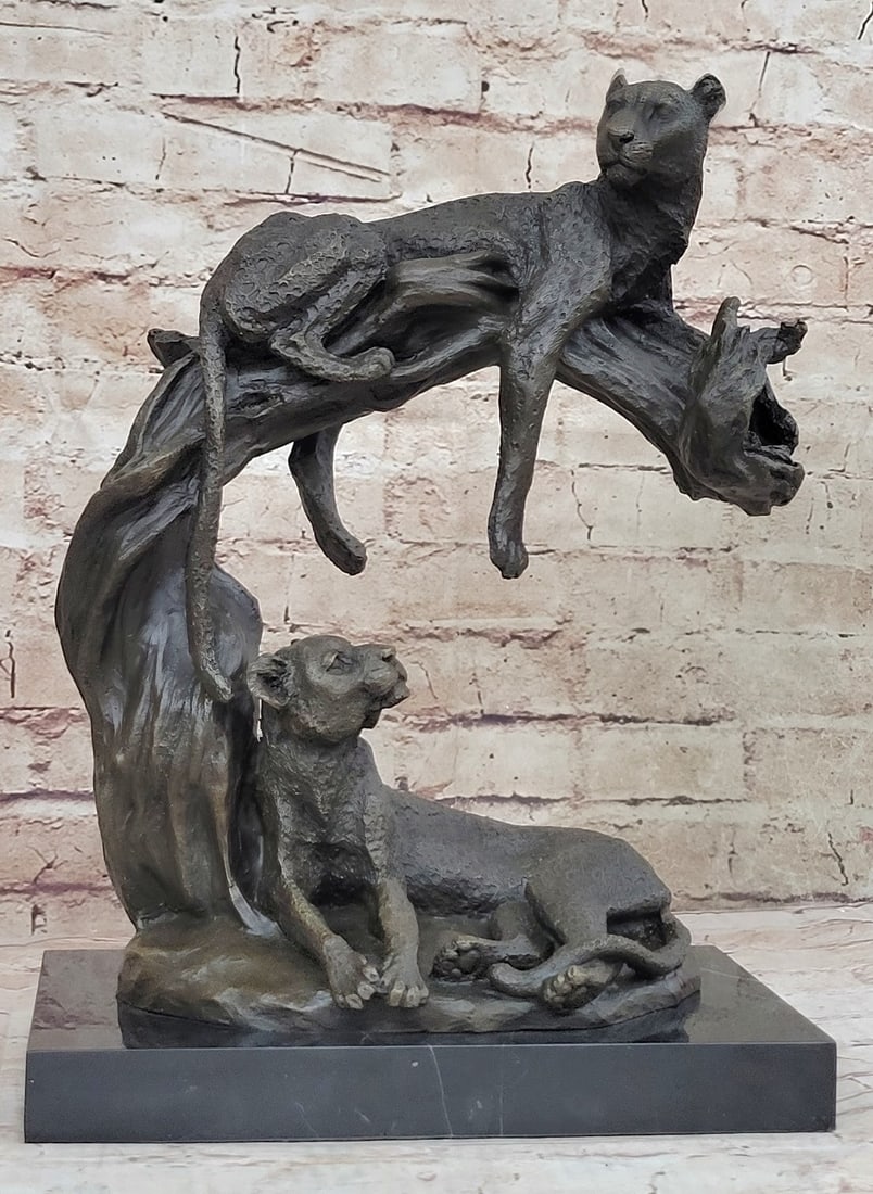 Wildlife African Lion and Baby Bust Bronze Sculpture: This beautiful family of Lions looks adorable, the mother is at peace while the father stands and paces back and forth on the lookout. The mother licks one of her little cubs while the other one rests