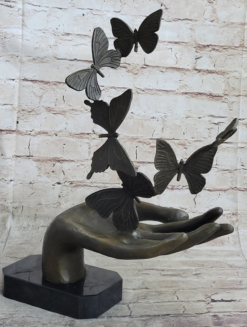 Butterfly Bronze Sculpture: Bronze sculpture shows hand unleashing butterflies and made of exclusive material bronze, very precisely, with attention to the smallest details. The sculpture makes a big aesthetic impression and has