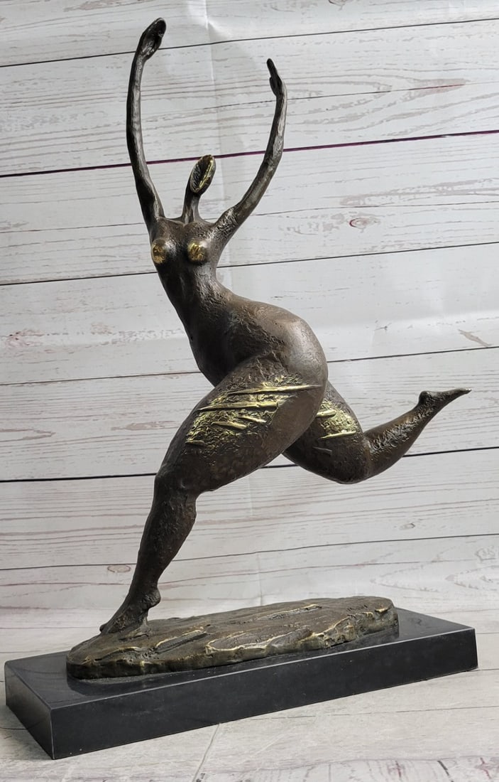 Female Figure Bronze Sculpture: An abstract female dancer sculpture. This wonderfully curvaceous woman bears the wide hips commonly attributed to femininity and fertility. This bronze sculpture was cast using the lost wax method and