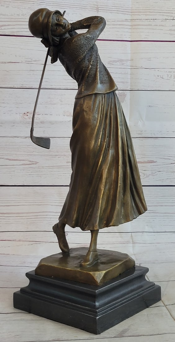 High Society English Lady Palying Golf Bronze Sculpture: This phenomenal sculpture of a woman standing in the most perfect golf stance will leave you wanting to know if she actually scored in the golf ball. She gracefully smiles as she patiently waits for t