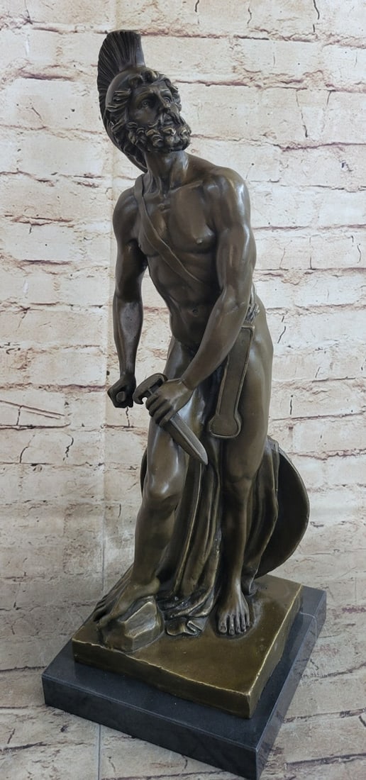 Roman Military Warrior Bronze Statue: The Roman legion soldier stands nude, except for some regalia, looking to the horizon of a scarred battlefield. On the top of his head, he wears a galea, which is a soldier helmet. A baldric strap acr