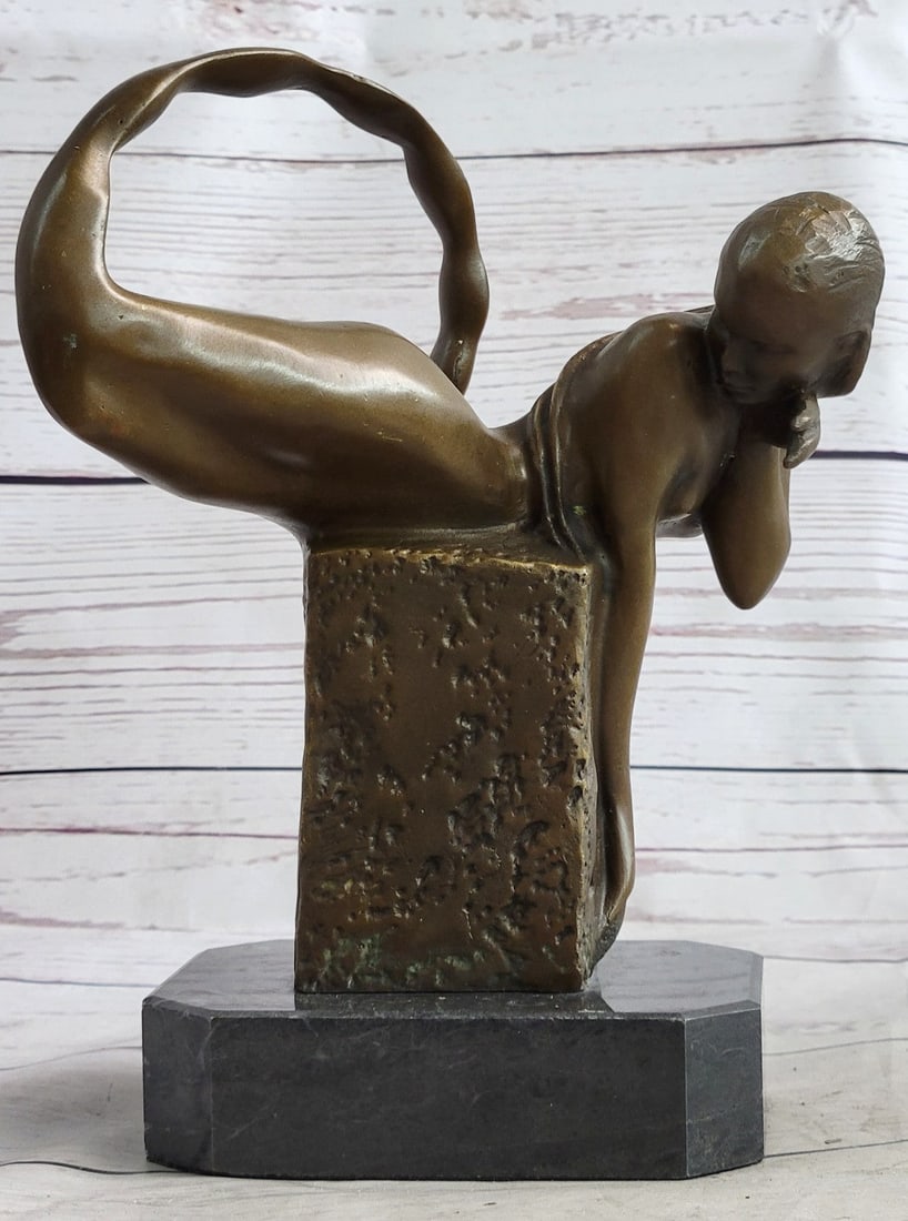 Mermaid Bronze Sculpture: This beautiful mermaid lays out on a rock above the ocean waters she calls home. Her hair and fin have a sea-green finish. The scales are perfectly and meticulously on her tail. Shells and starfishes 