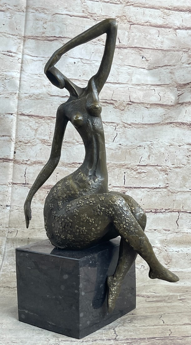Sensual Woman Bronze Sculpture: An abstract female dancer sculpture. You can just tell this is a powerful dancer in the sharpness of her position. This wonderfully curvaceous woman bears the wide hips commonly attributed to