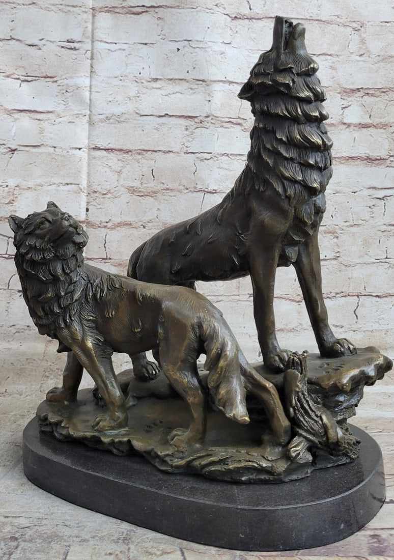 Howling Wolf Bronze Sculpture: When people think of wolves they think of their lethal hunting skills, howling, and the pack. The creation of a wolf family is unique for animals. Wolves are social predators that live in nuclear