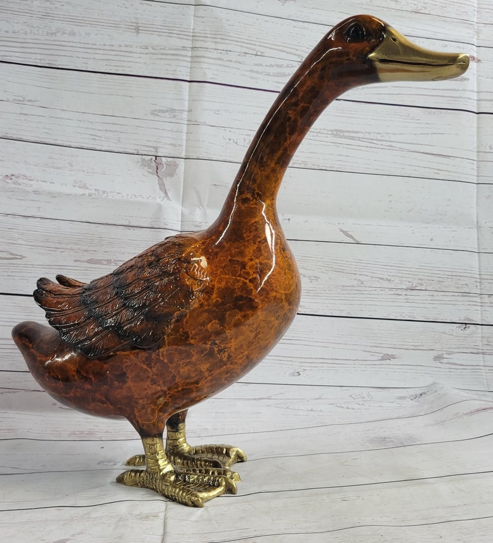 Duck Bronze Statue: Delightful Duck Bronze Sculpture. This Bronze Sculpture was produced using the Lost Wax casting method. The Lost Wax Cast method is the most precise metal casting technique in existence, ensuring exqu