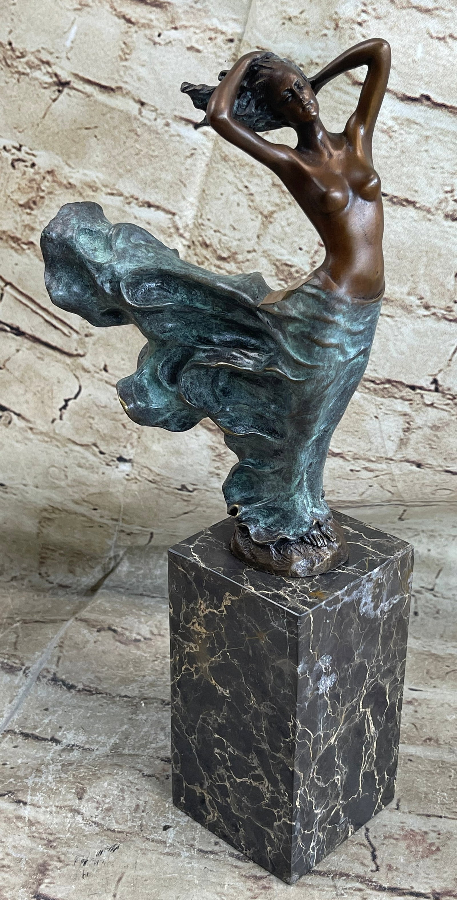 Mermaid Sea Goddess Bronze Statue: This dancer is light on her feet and moves fluidly like rolling waves. Her movements are wild and free. She is full of energy and spirit. This gorgeous gypsy performs her classic belly dance, letting 