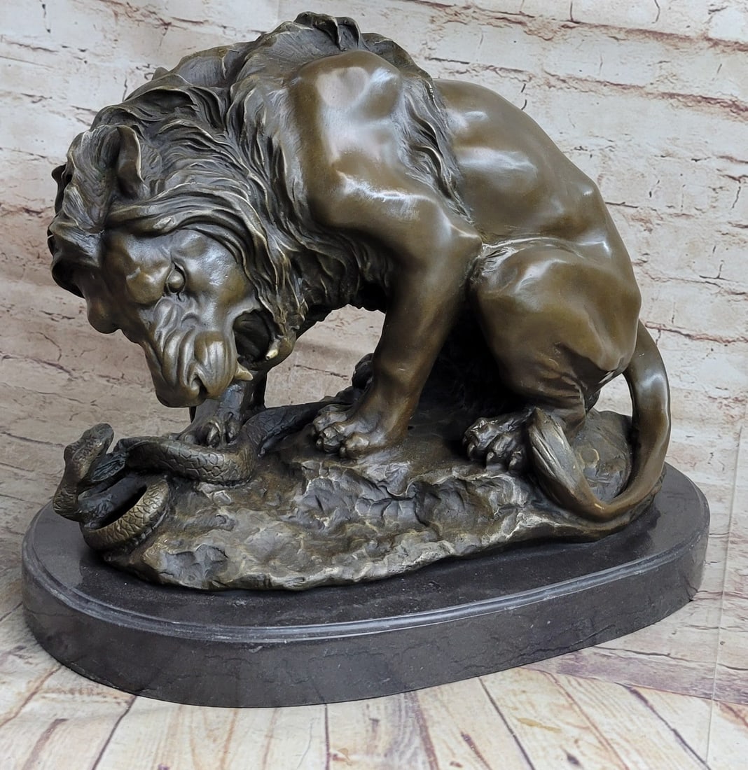 Lion and Snake Bronze Statue: This is a beautifully sculpted piece of a lion and a serpent in the standoff. The majestic male lion, irritated by the hissing venomous threats of the snake, bends down, cowering over the coiling