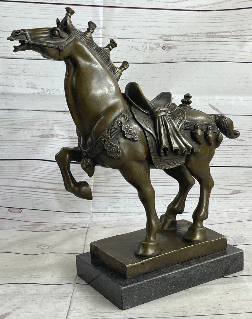 Famous Chinese Tang Horse Bronze Sculpture: Horses are known and loved for their agility, graceful movement, strong bodies, and sleek coat. They ignite a feeling of freedom and uncharted paths. This brown patina sculpture was cast using the Los